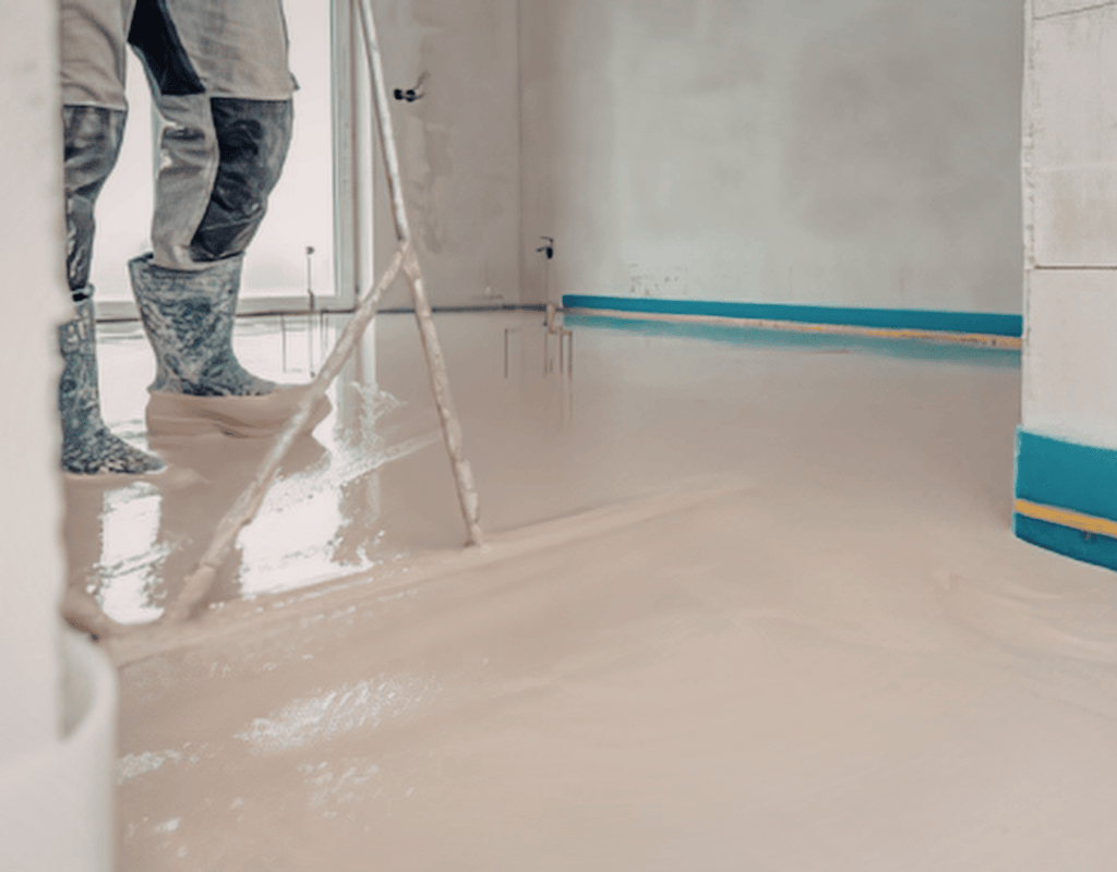 contractor applying epoxy floor coating on residential surface in Bergen County NJ