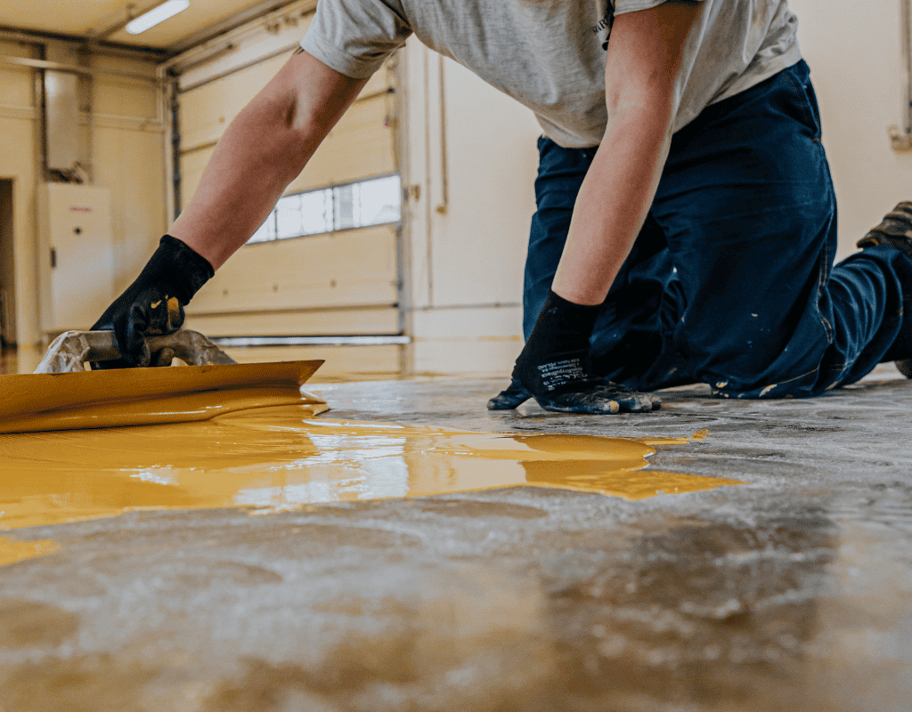 contractor applying polyurethane floor coating for durable surface in Bergen County NJ
